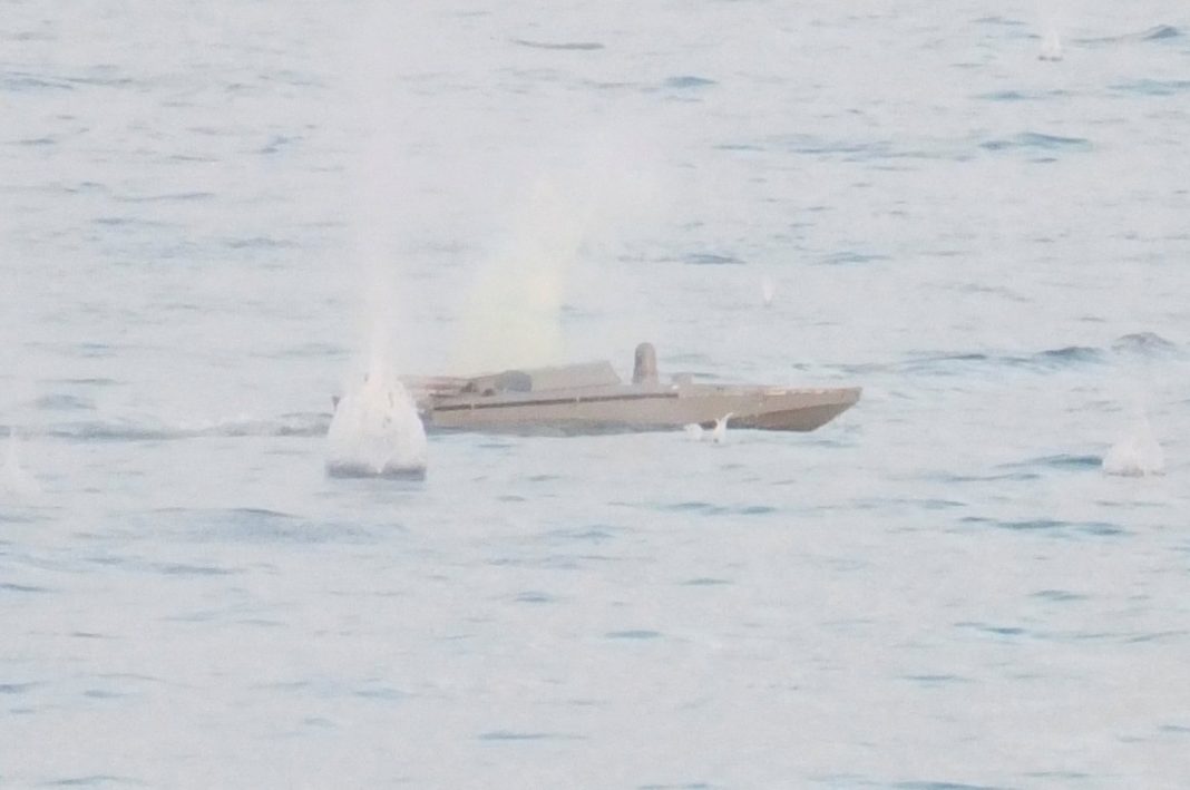 Sebuah gambar diam dari sebuah video, yang dirilis oleh Kementerian Pertahanan Rusia, menunjukkan apa yang dikatakannya sebagai kapal drone Ukraina yang menyerang kapal perang Rusia Priazovye di Laut Hitam dalam gambar ini diambil dari rekaman handout yang dirilis 11 Juni 2023. (Foto Reuters)